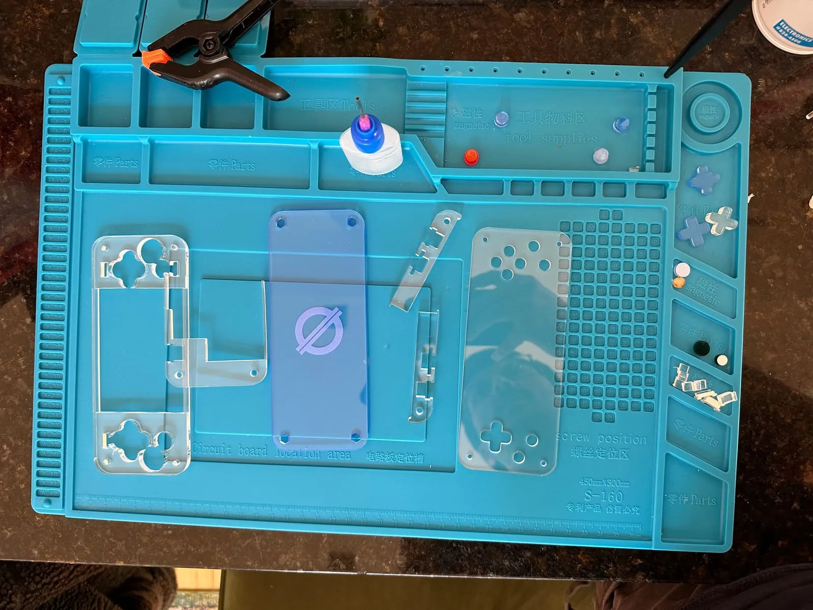Acrylic case panels for the Null 2 laid out with glue stains visible